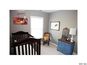 1035 Market Street, Unit 1035 Fort Mill, SC 29708 - Photo 13 of 16 a black leather chair in a living room