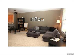 1035 Market Street, Unit 1035 Fort Mill, SC 29708 - Photo 4 of 16 a living room with furniture and a couch