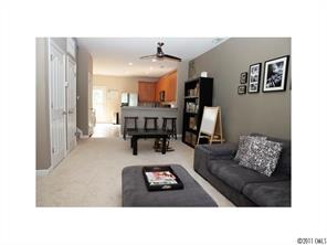 1035 Market Street, Unit 1035 Fort Mill, SC 29708 - Photo 6 of 16 a living room with furniture and a dining table