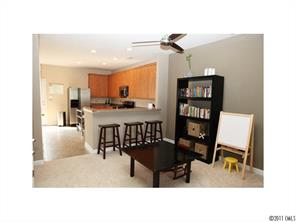 1035 Market Street, Unit 1035 Fort Mill, SC 29708 - Photo 7 of 16 a dining room with furniture and a kitchen view