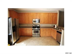 1035 Market Street, Unit 1035 Fort Mill, SC 29708 - Photo 8 of 16 a kitchen with a refrigerator stove and sink