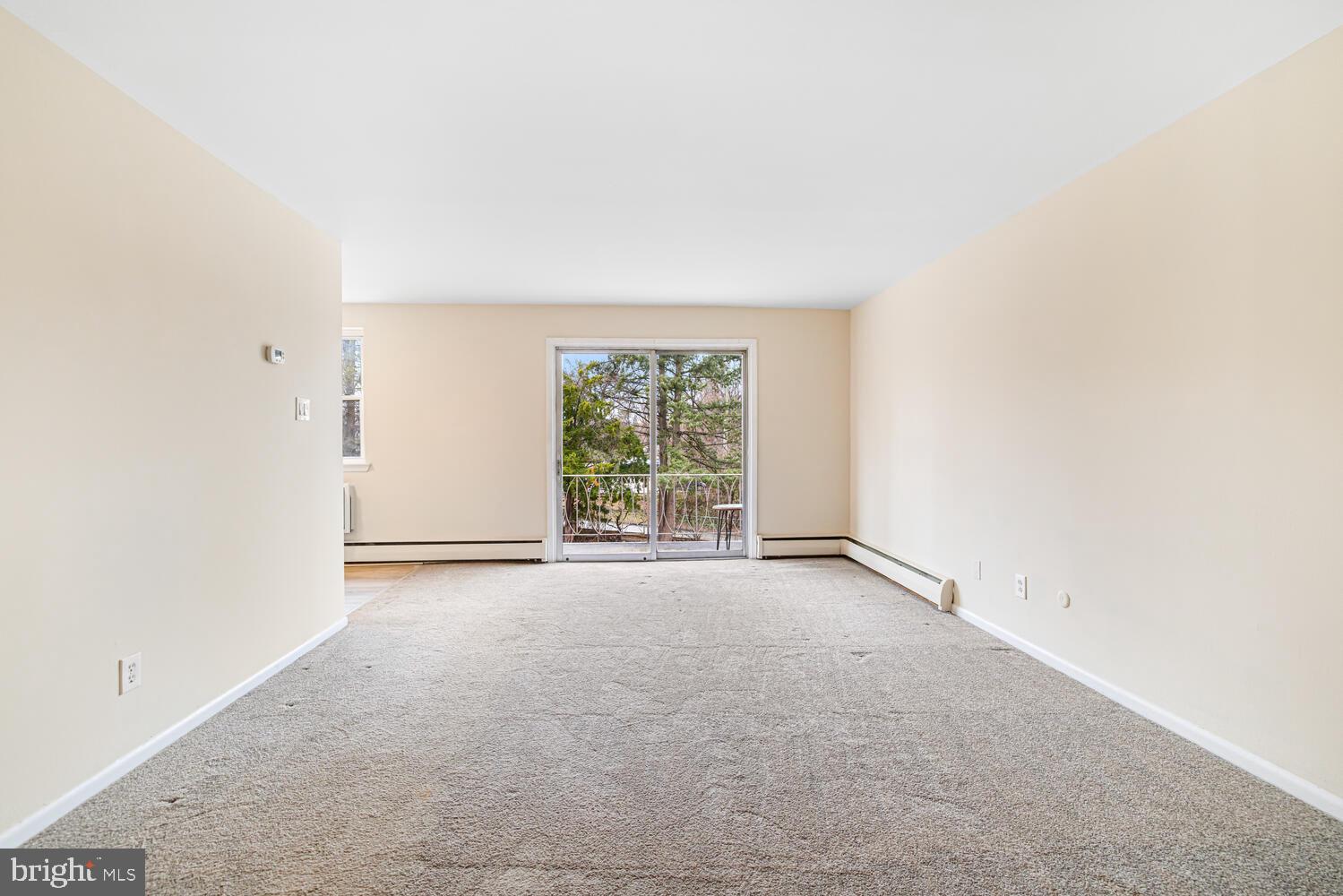 1600 Church Road, Unit D205 Wyncote, PA 19095 - Photo 4 of 21 an empty room with windows