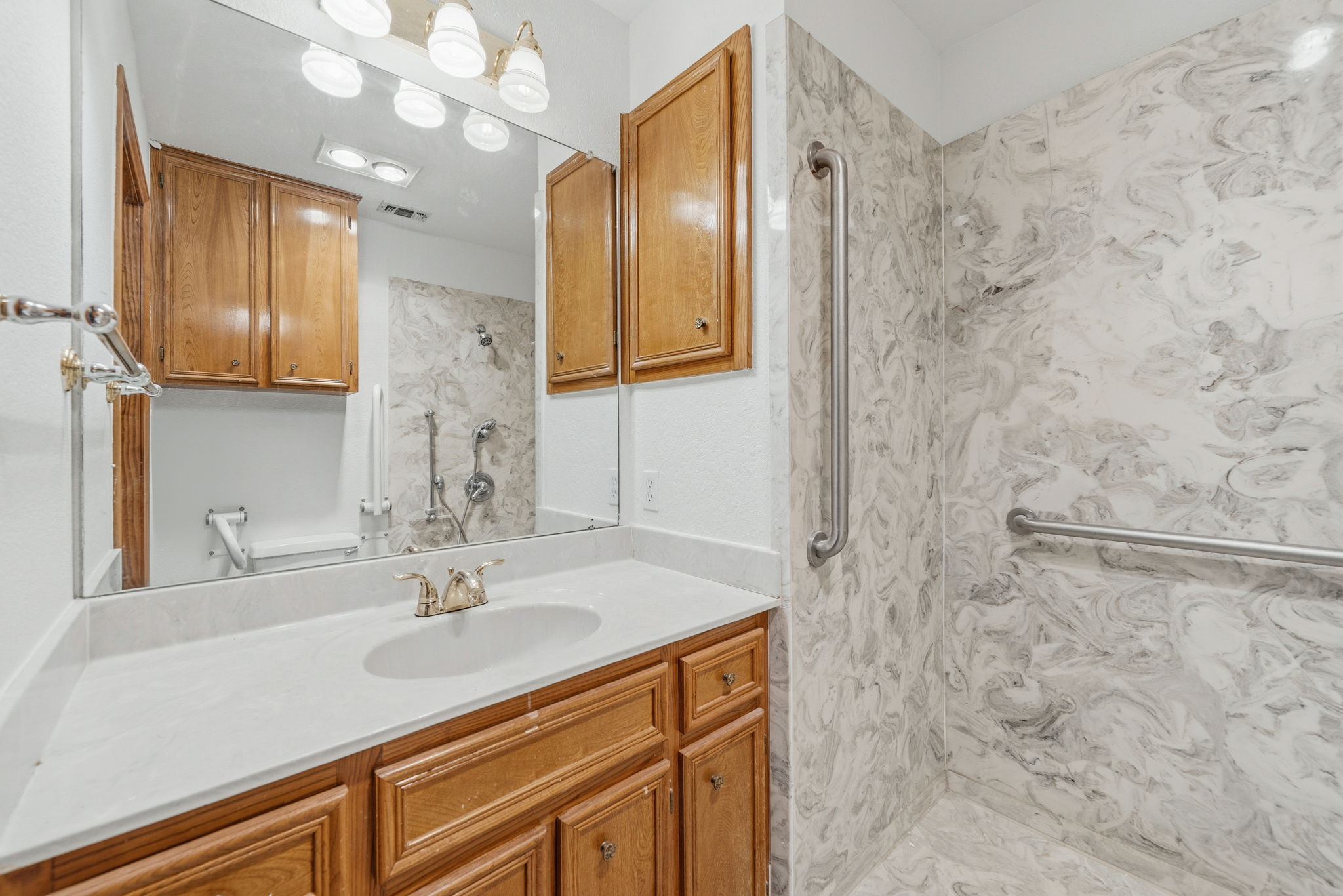 1403 Stone Ridge Drive Taylor, TX 76574 - Photo 24 of 30 a bathroom with a sink and a mirror