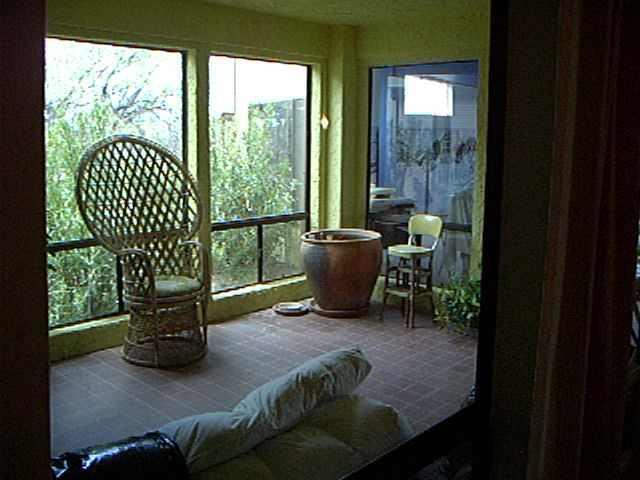 433 Camino Canoa Rio Rico, AZ 85648 - Photo 8 of 9 a living room with furniture and a floor to ceiling window
