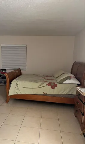 a view of walk in closet with clothes