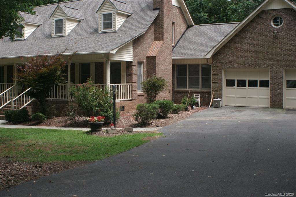 1160 Ben Black Road Midland, NC 28107 - Photo 2 of 28 a front view of a house with a yard and potted plants