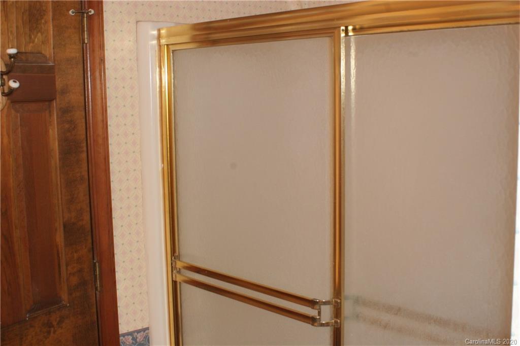 1160 Ben Black Road Midland, NC 28107 - Photo 12 of 28 a bathroom with a glass shower door