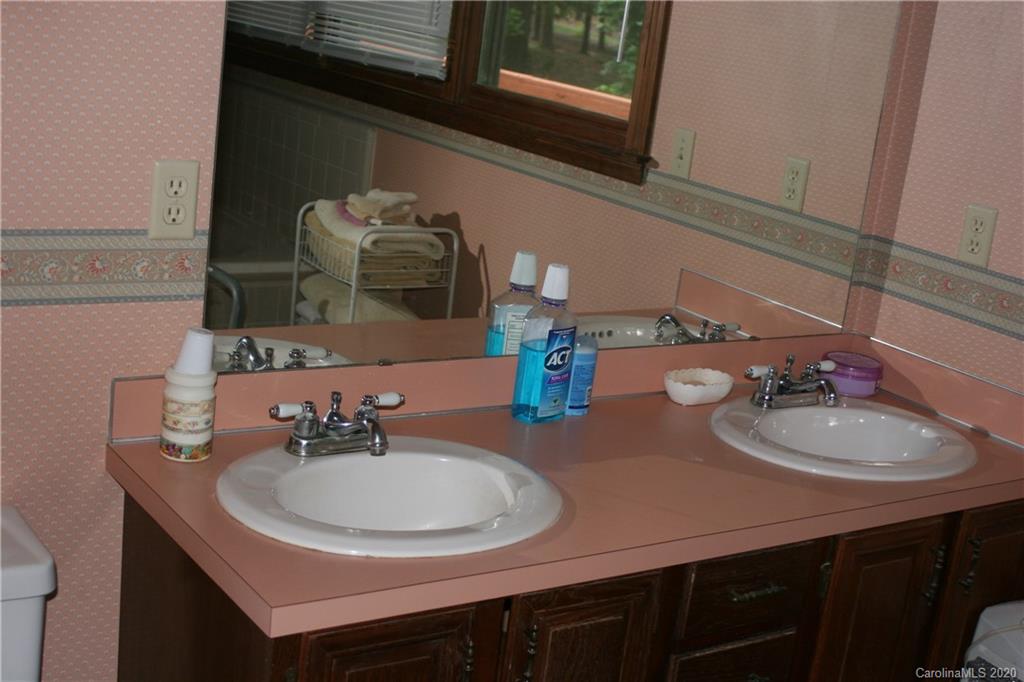 1160 Ben Black Road Midland, NC 28107 - Photo 21 of 28 a bathroom with a sink and a mirror