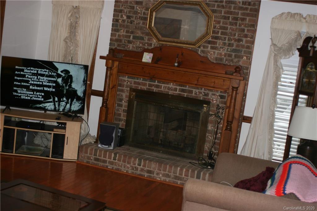 1160 Ben Black Road Midland, NC 28107 - Photo 23 of 28 a living room with furniture and a fireplace