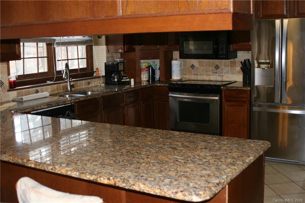 1160 Ben Black Road Midland, NC 28107 - Photo 25 of 28 a kitchen with a sink a counter top space and stainless steel appliances
