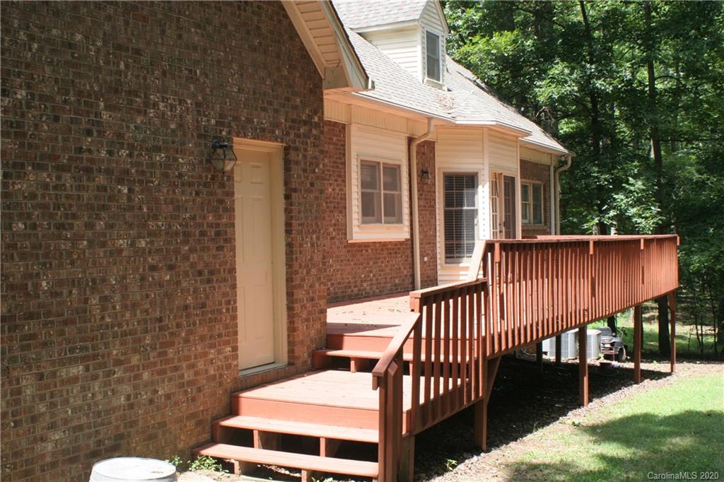 1160 Ben Black Road Midland, NC 28107 - Photo 4 of 28 a balcony with wooden floor and outdoor seating