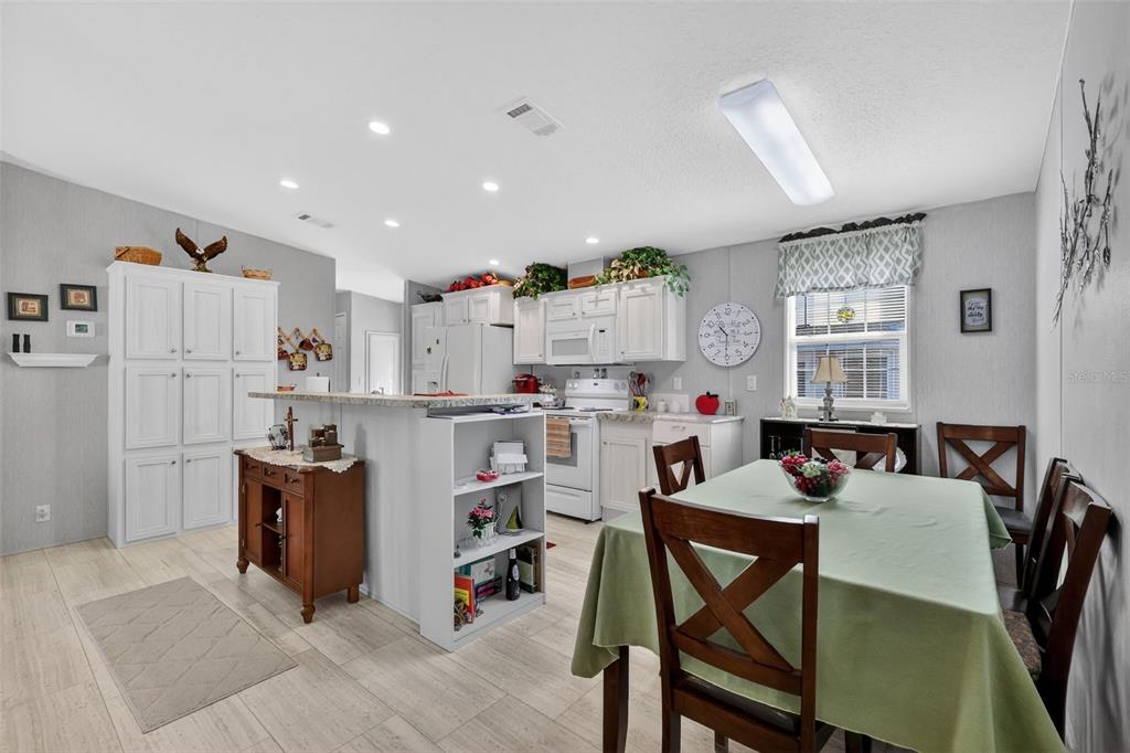 11523 Marvell Way Leesburg, FL 34788 - Photo 12 of 40 a living room with furniture and a dining table