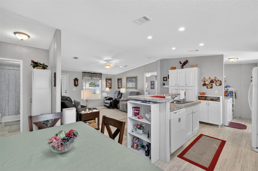 11523 Marvell Way Leesburg, FL 34788 - Photo 13 of 40 a living room with furniture and a flat screen tv