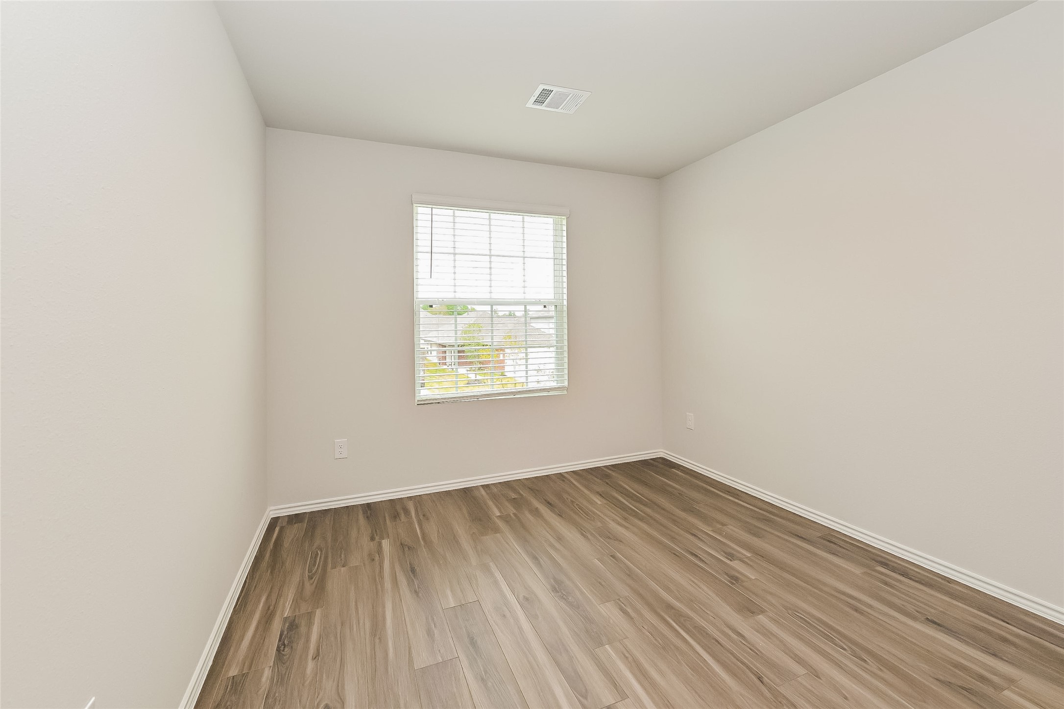 1128 Copal Trail Conroe, TX 77301 - Photo 14 of 22 an empty room with a window