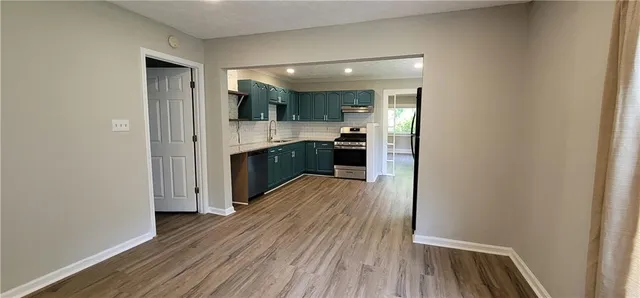 a view of a kitchen from the hallway