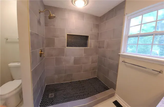 a bathroom with a sink and a shower