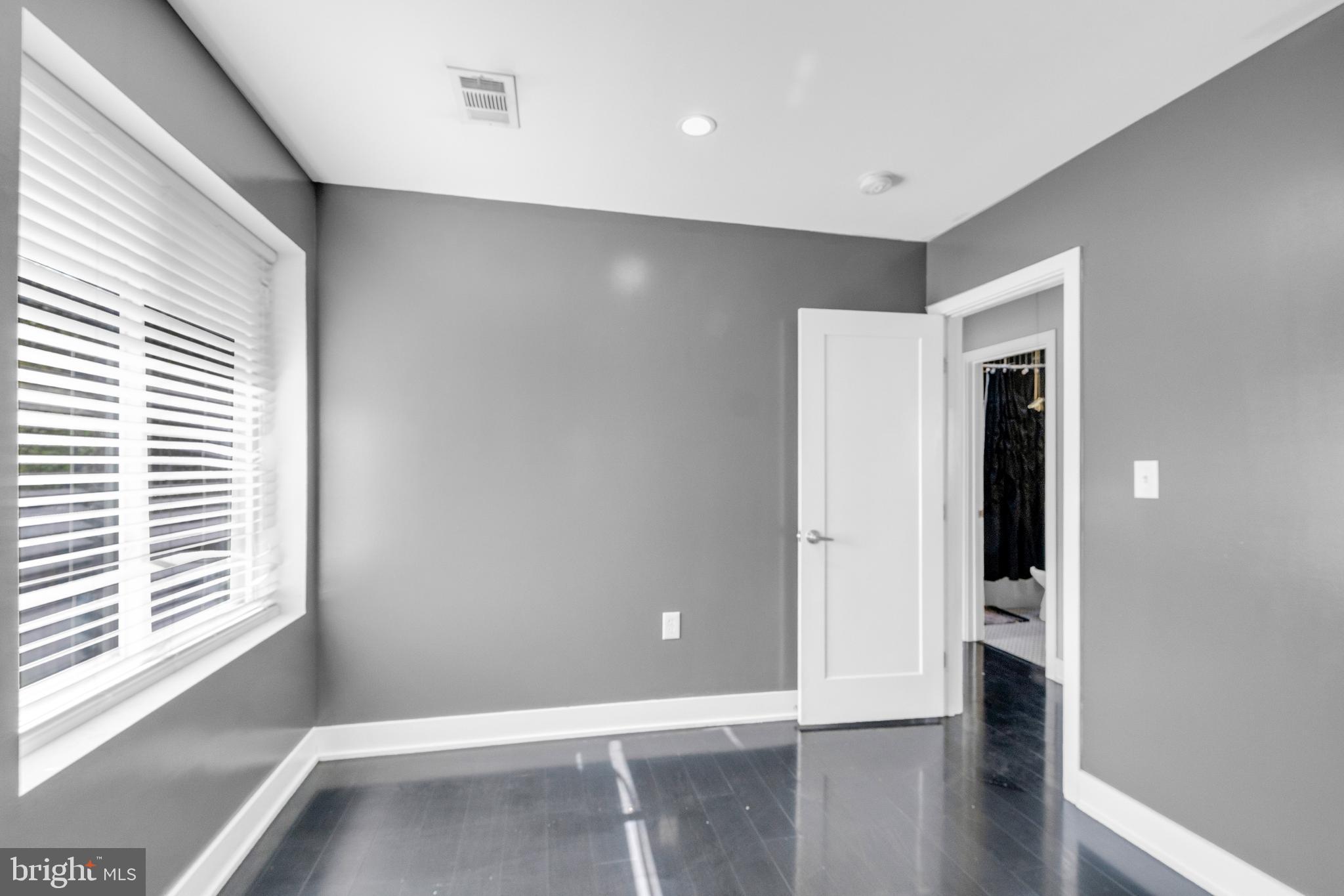7600 Normandy Road Landover, MD 20785 - Photo 17 of 26 a view of livingroom with hallway and wooden floor