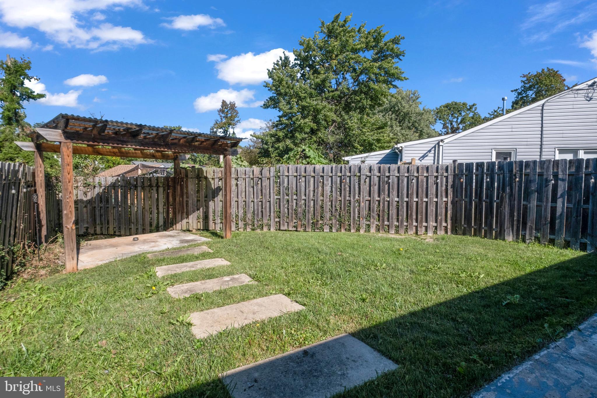 7600 Normandy Road Landover, MD 20785 - Photo 24 of 26 a view of a backyard with wooden fence