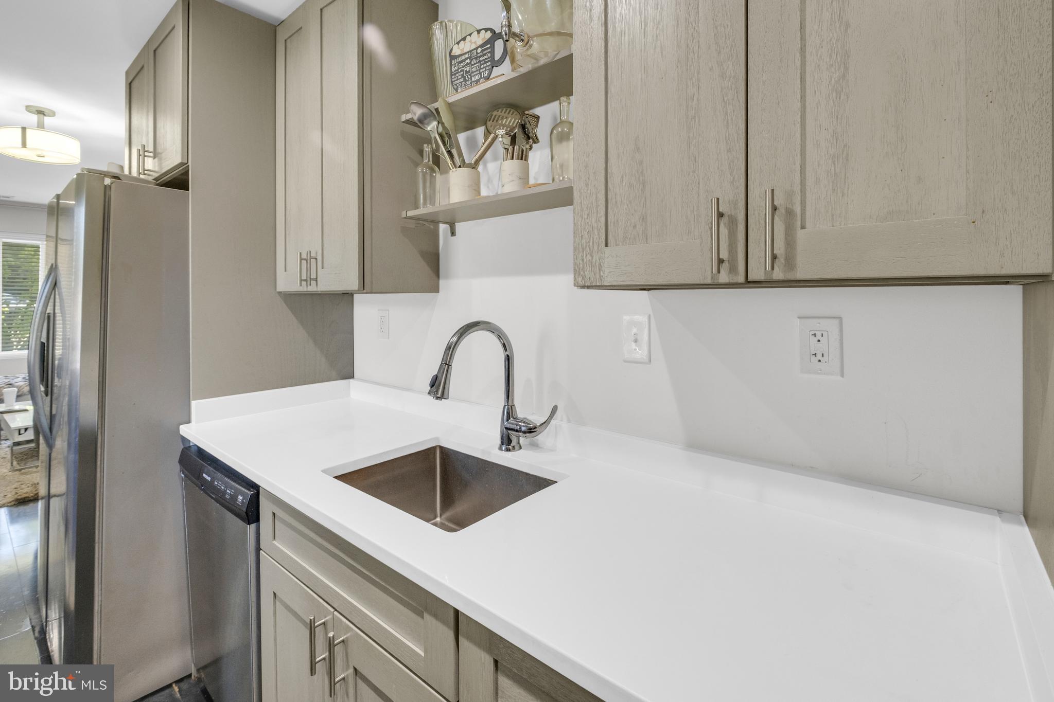 7600 Normandy Road Landover, MD 20785 - Photo 9 of 26 a kitchen with a sink and cabinets