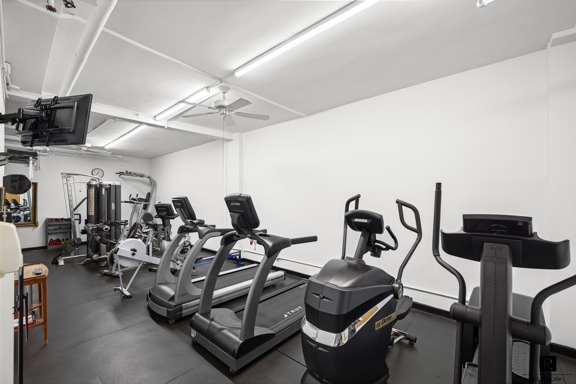 390 Riverside Drive, Unit 5G Manhattan, NY 10025 - Photo 10 of 14 a view of a room with gym equipment