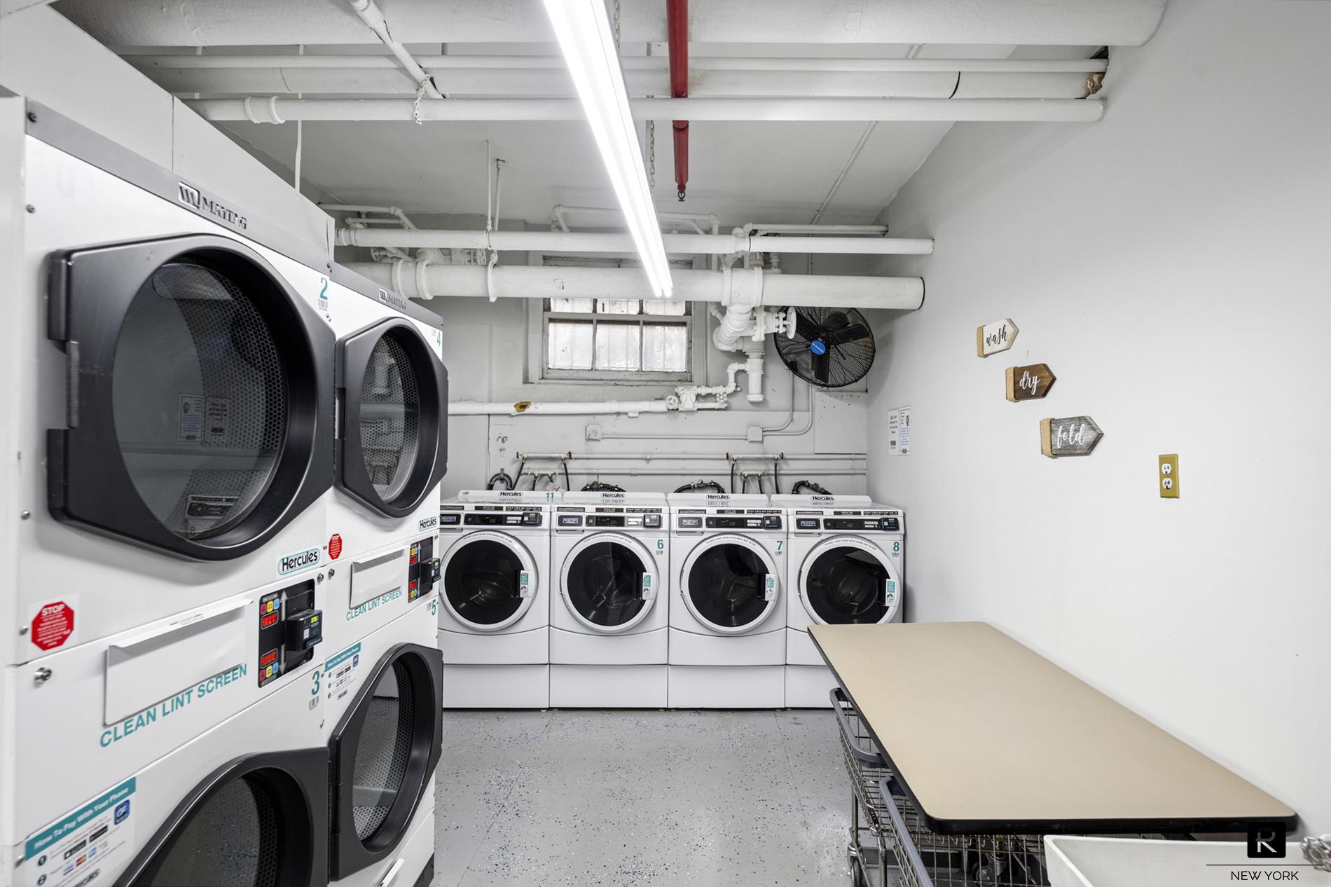 390 Riverside Drive, Unit 5G Manhattan, NY 10025 - Photo 12 of 14 a utility room with dryer and washer
