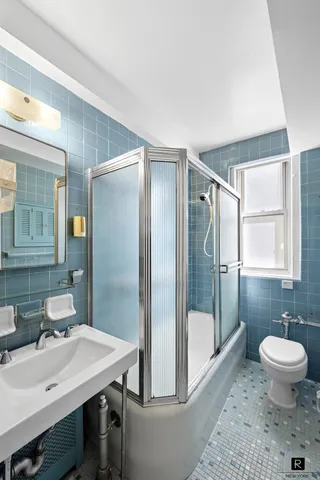 a view of a room that has a large window