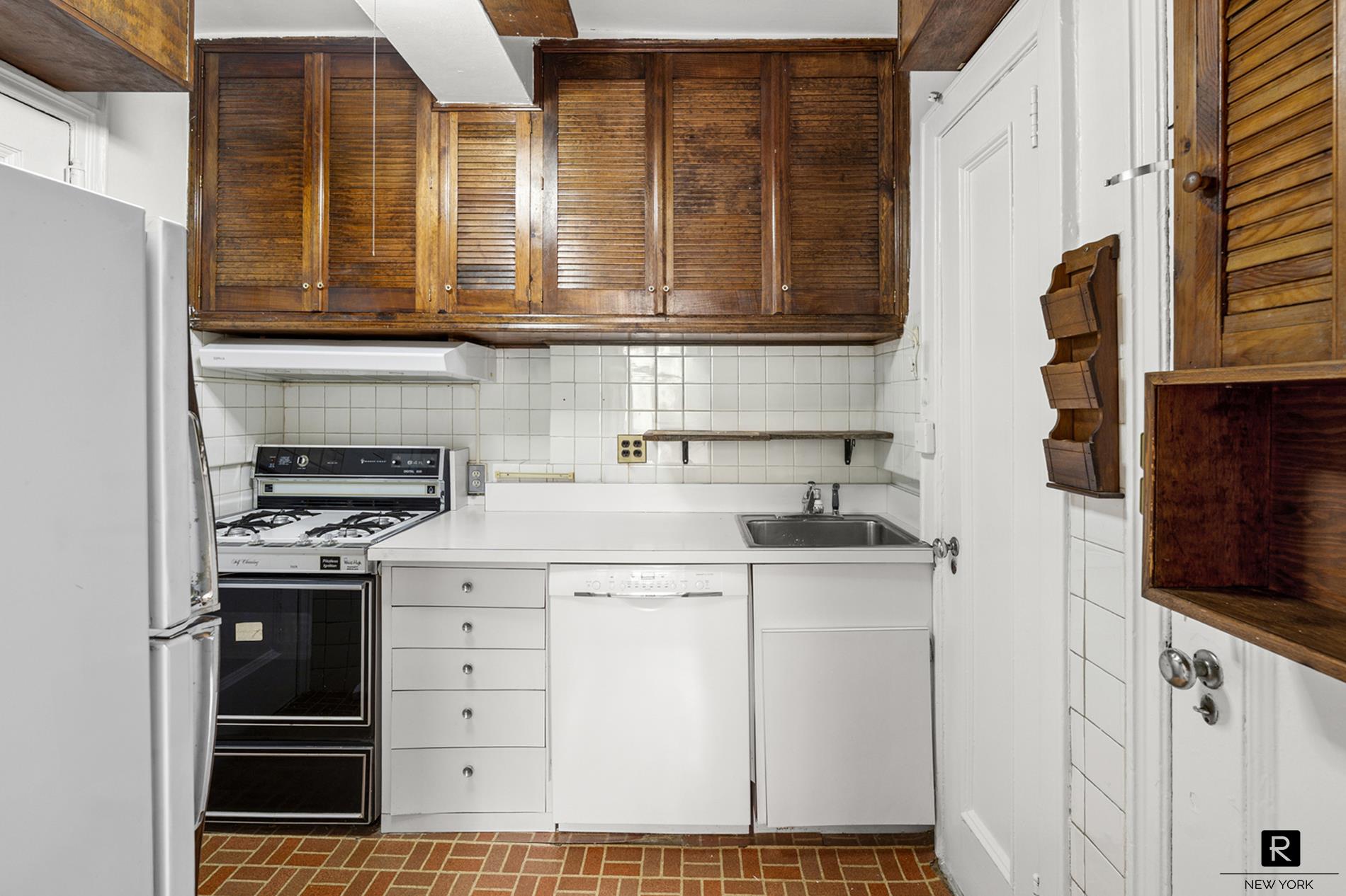 390 Riverside Drive, Unit 5G Manhattan, NY 10025 - Photo 9 of 14 a kitchen with stainless steel appliances granite countertop a stove and a sink