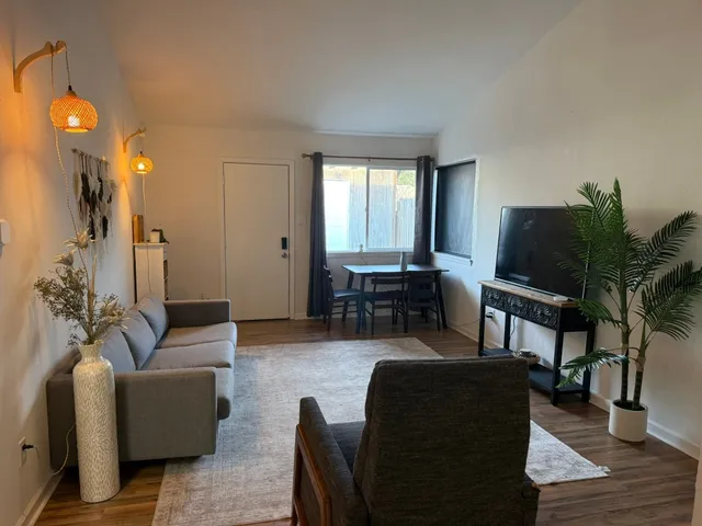 a bathroom with a double vanity sink toilet and shower