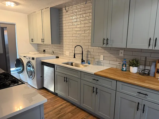 a living room with a bed furniture and a window