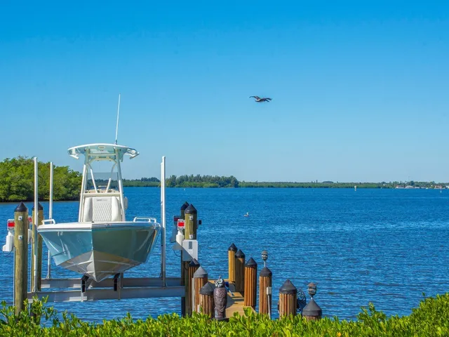 a view of a chairs and table in patio with wooden fence