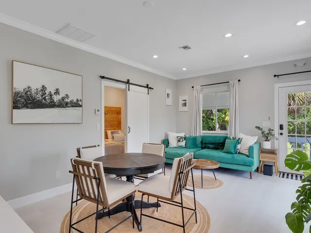 a view of a dining room with furniture window and outside view