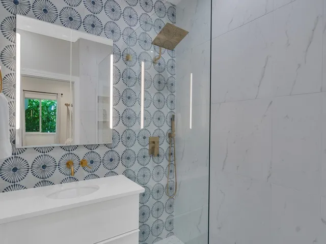 a bathroom with a bathtub and a shower