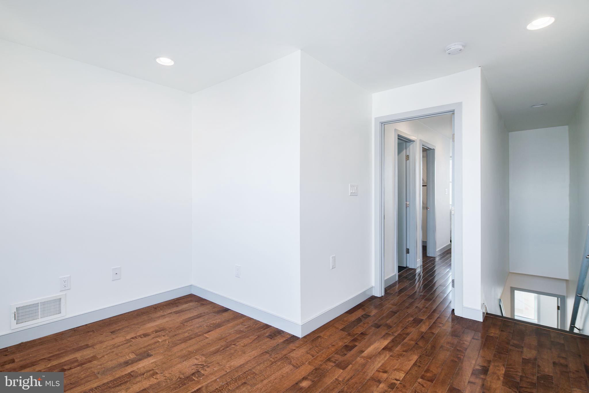 1235 North Taney Street Philadelphia, PA 19121 - Photo 18 of 28 a view of a room with wooden floor