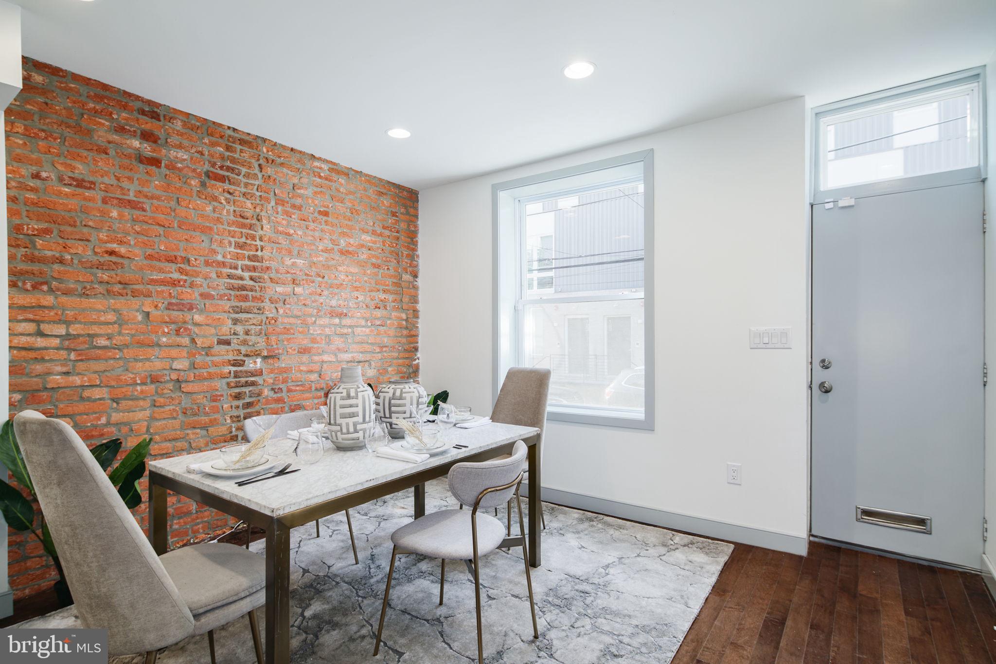 1235 North Taney Street Philadelphia, PA 19121 - Photo 2 of 28 a view of a dining room with furniture and wooden floor