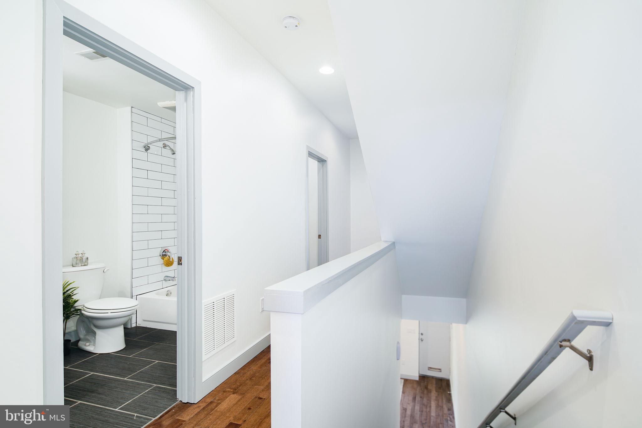1235 North Taney Street Philadelphia, PA 19121 - Photo 10 of 28 a bathroom with a sink a toilet and shower