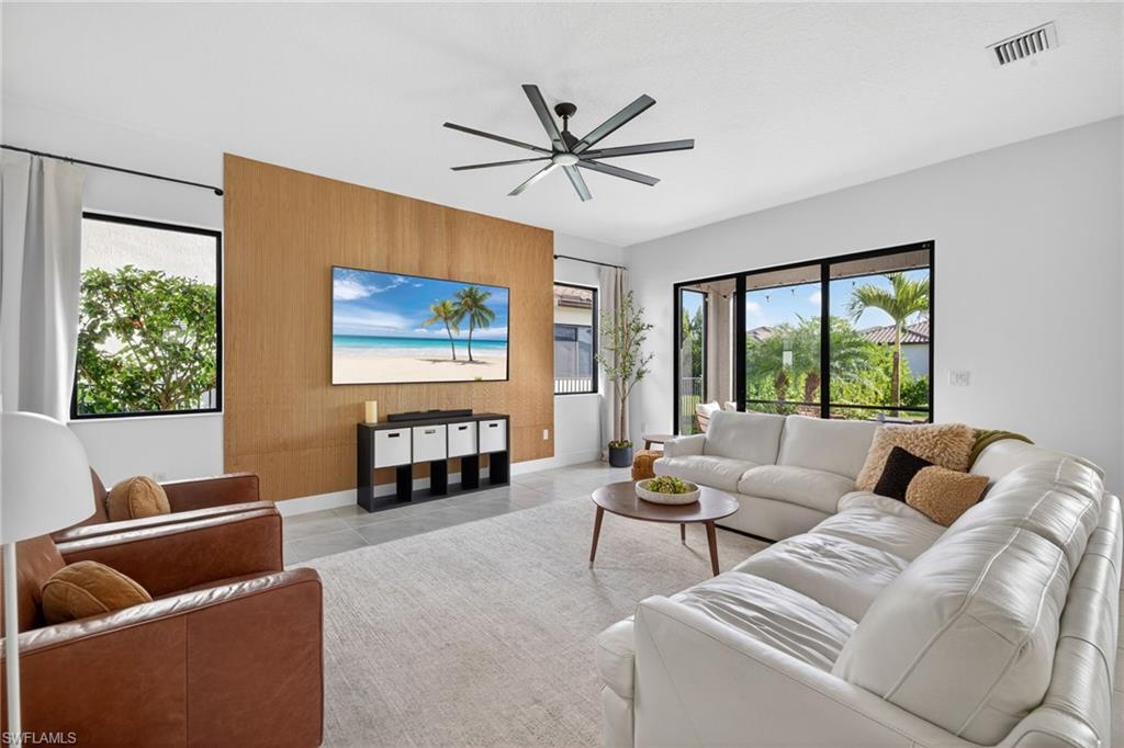 5104 Isidora Lane Ave Maria, FL 34142 - Photo 2 of 28 a living room with furniture a couch and a large window