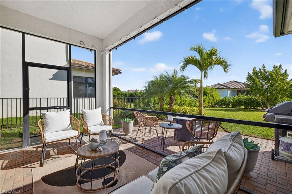 5104 Isidora Lane Ave Maria, FL 34142 - Photo 22 of 28 a balcony with furniture and garden view