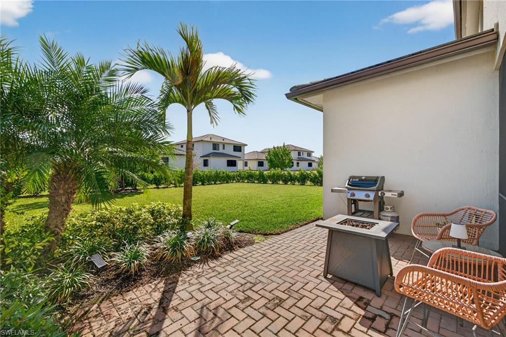 5104 Isidora Lane Ave Maria, FL 34142 - Photo 23 of 28 a view of a backyard with plants and a garden