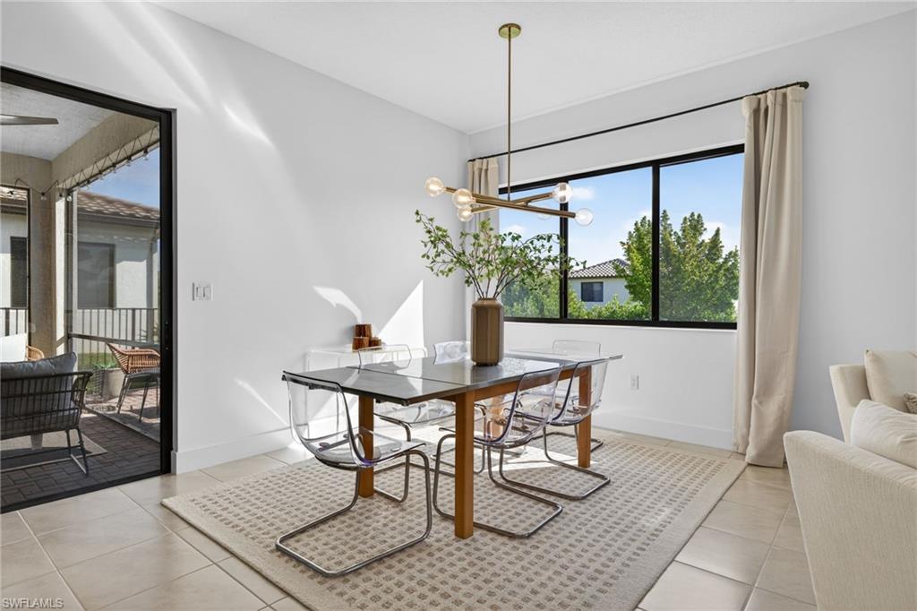 5104 Isidora Lane Ave Maria, FL 34142 - Photo 7 of 28 a view of a dining room with furniture window and outside view