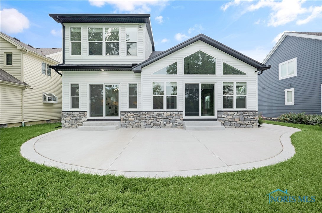 9414 Sheffield Road Perrysburg, OH 43551 - Photo 30 of 34 Gorgeous from the back and a spacious patio great for summer entertaining.