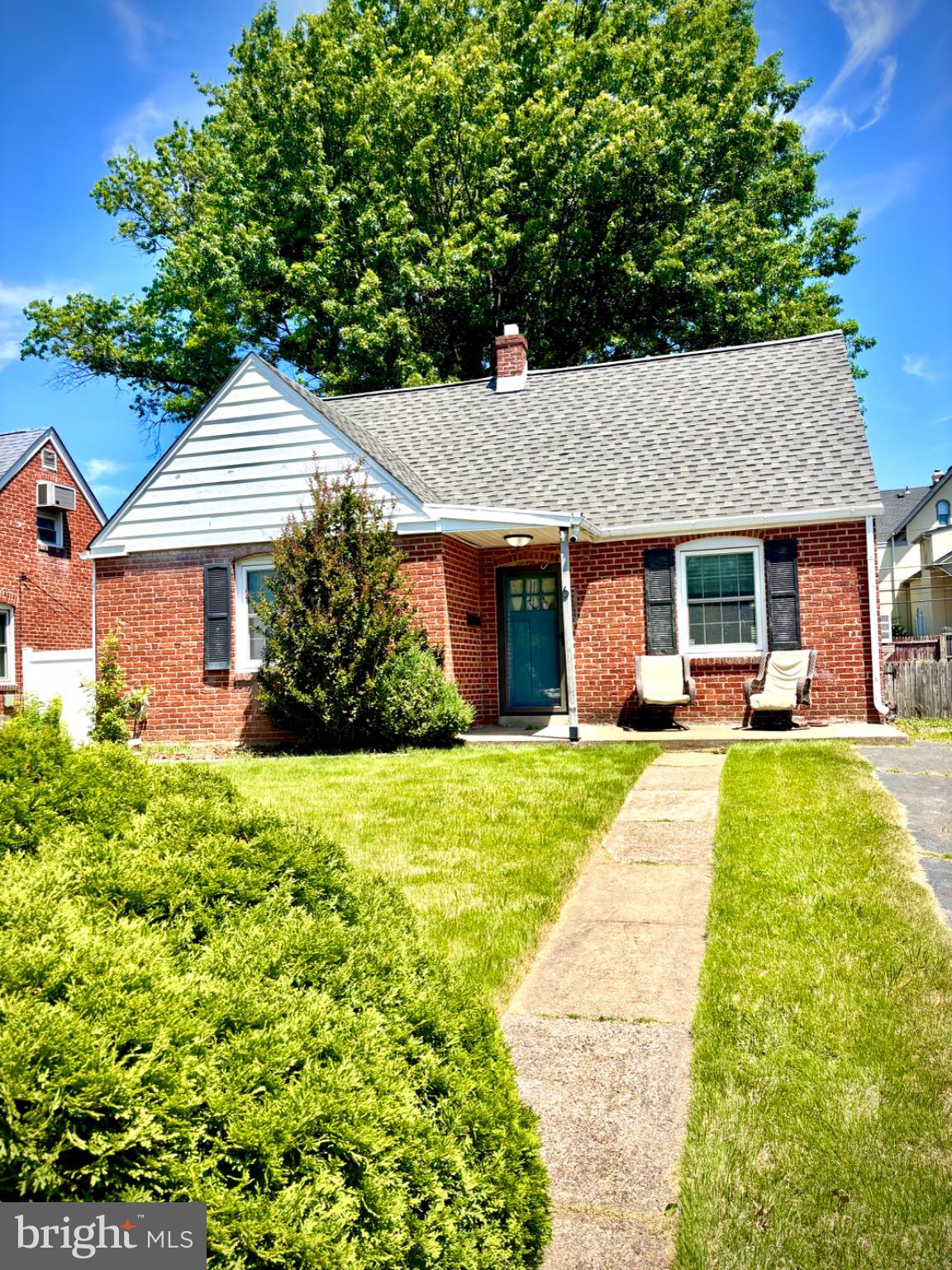 6 James Road Hatboro, PA 19040 - Photo 2 of 18 Charming brick home with lush greenery.