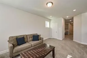 a bedroom with a bed dresser and a window