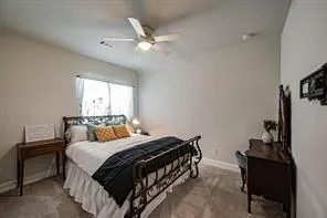 a bedroom with a bed and a dresser