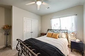 a bathroom with a double vanity sink toilet and a mirror