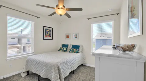 a bedroom with a bed and a table