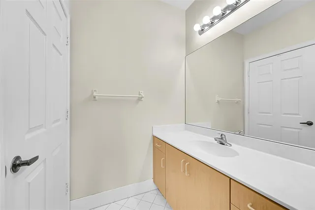 a bathroom with a sink and mirror