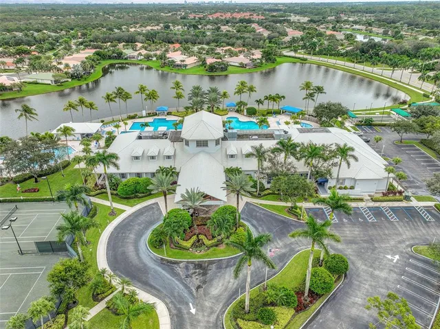 an aerial view of house with yard swimming pool and outdoor seating