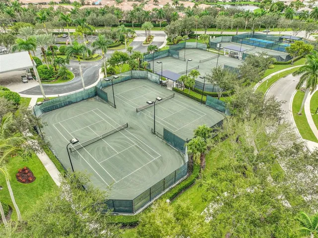 an aerial view of residential house with outdoor space and lake view