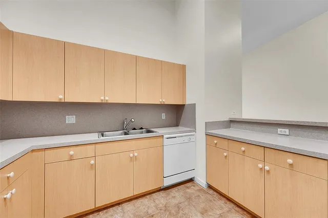 a kitchen with white cabinets