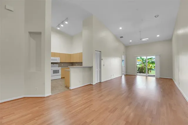 a view of kitchen with cabinets and wooden floor